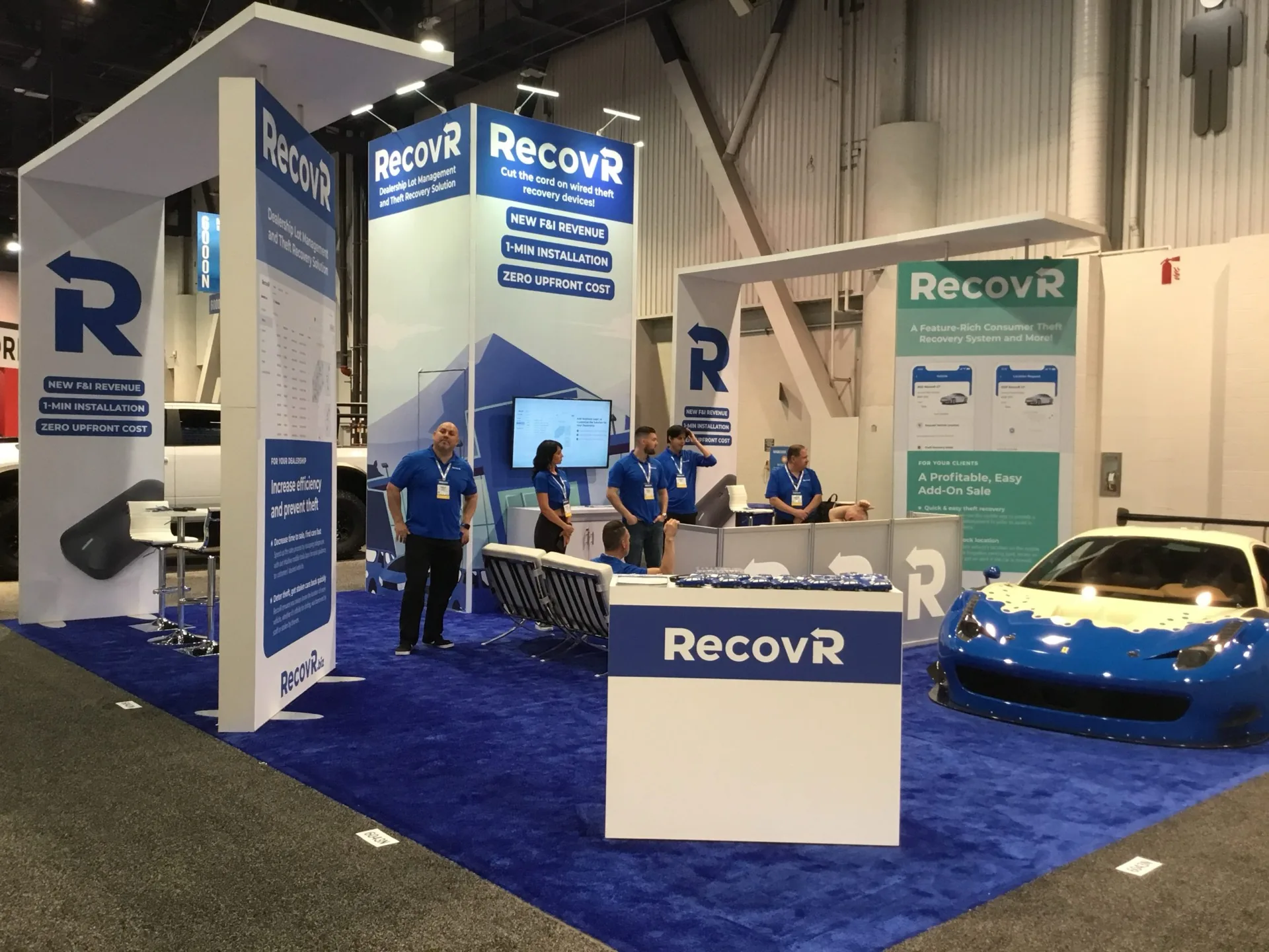 RecovR exhibit on the show floor with a vehicle on display.